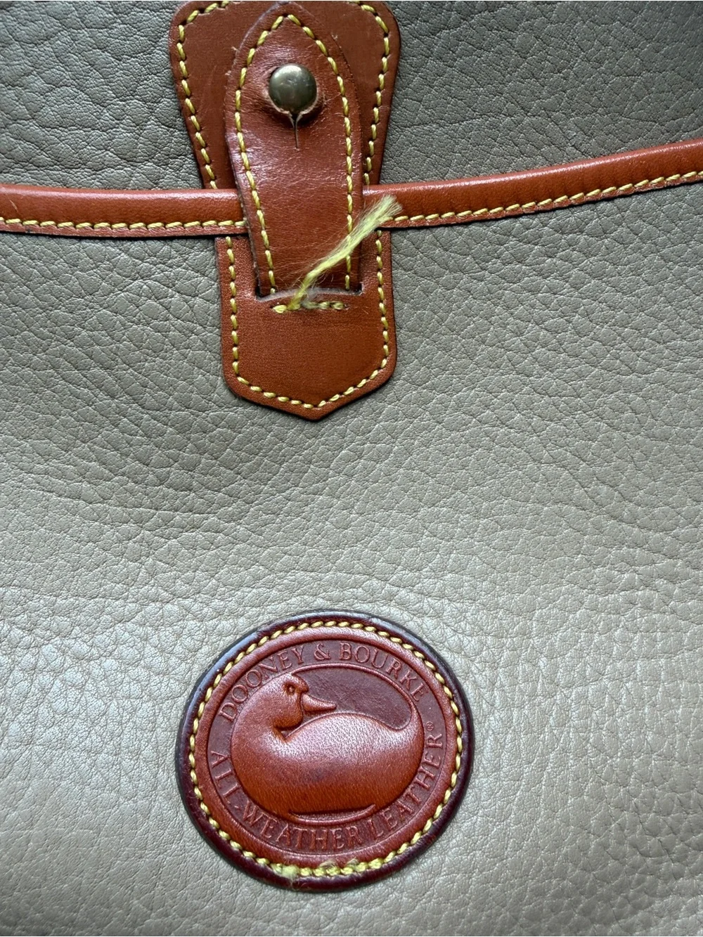 Dooney & Bourke Beige Leather Drawstring Backpack with Tan Trim
